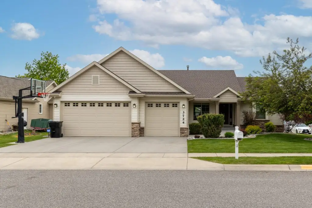 tan house 3 car garage