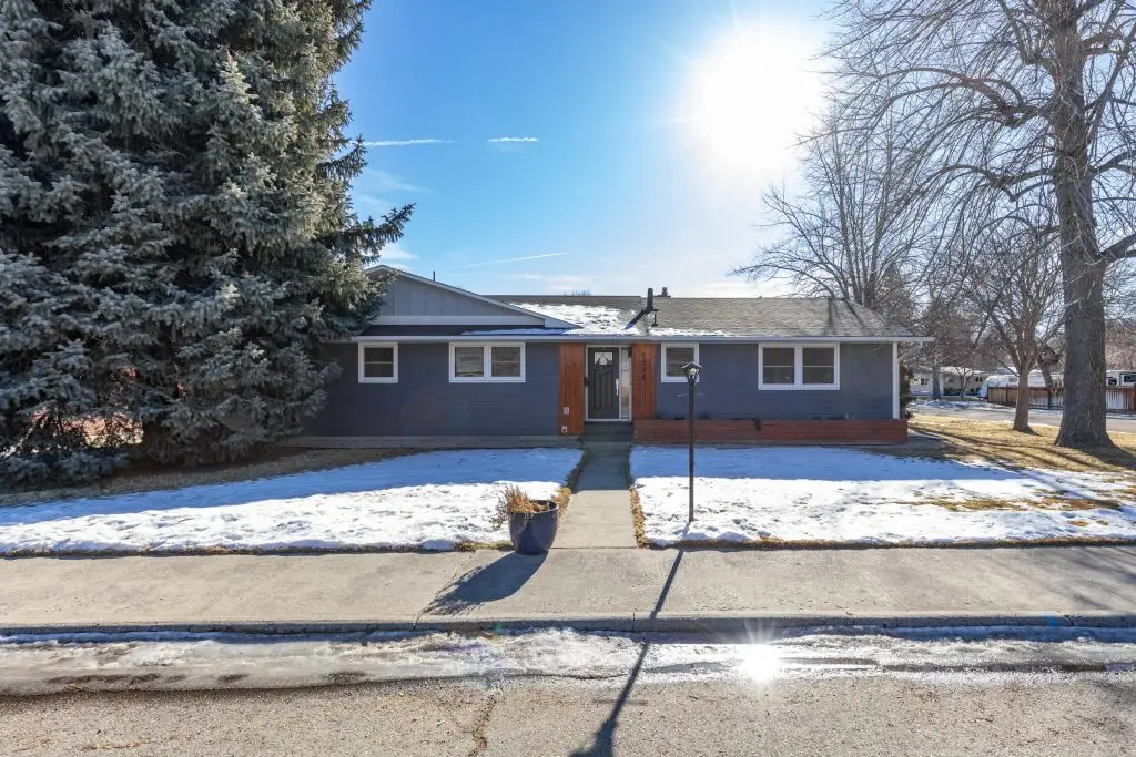 one story blue house with red brick